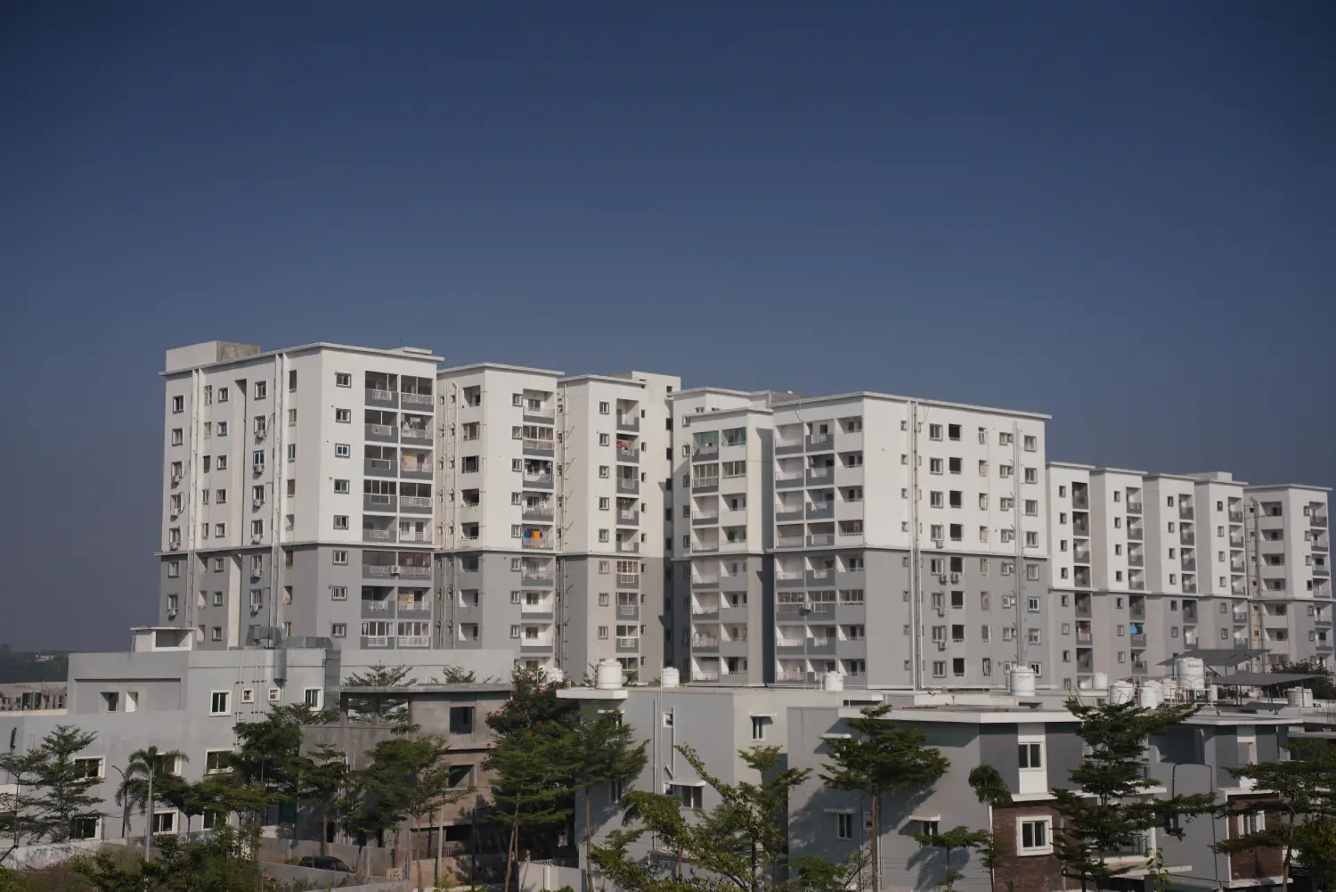 Assisted living for seniors in Kukatpally Hyderabad Telangana — caregiver attending elderly resident in facility courtyard