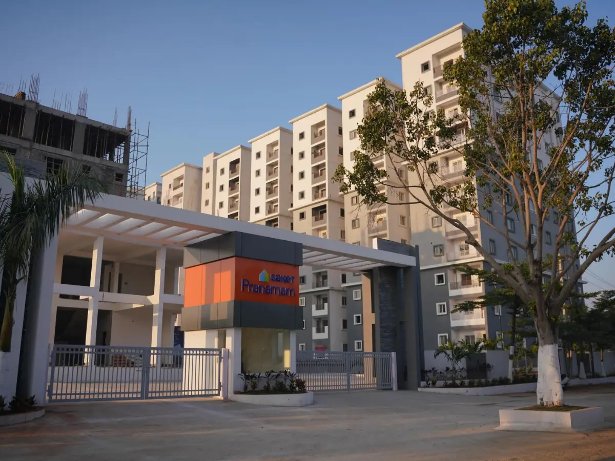 Assisted living for seniors in Kukatpally Hyderabad Telangana — caregiver attending elderly resident in facility courtyard