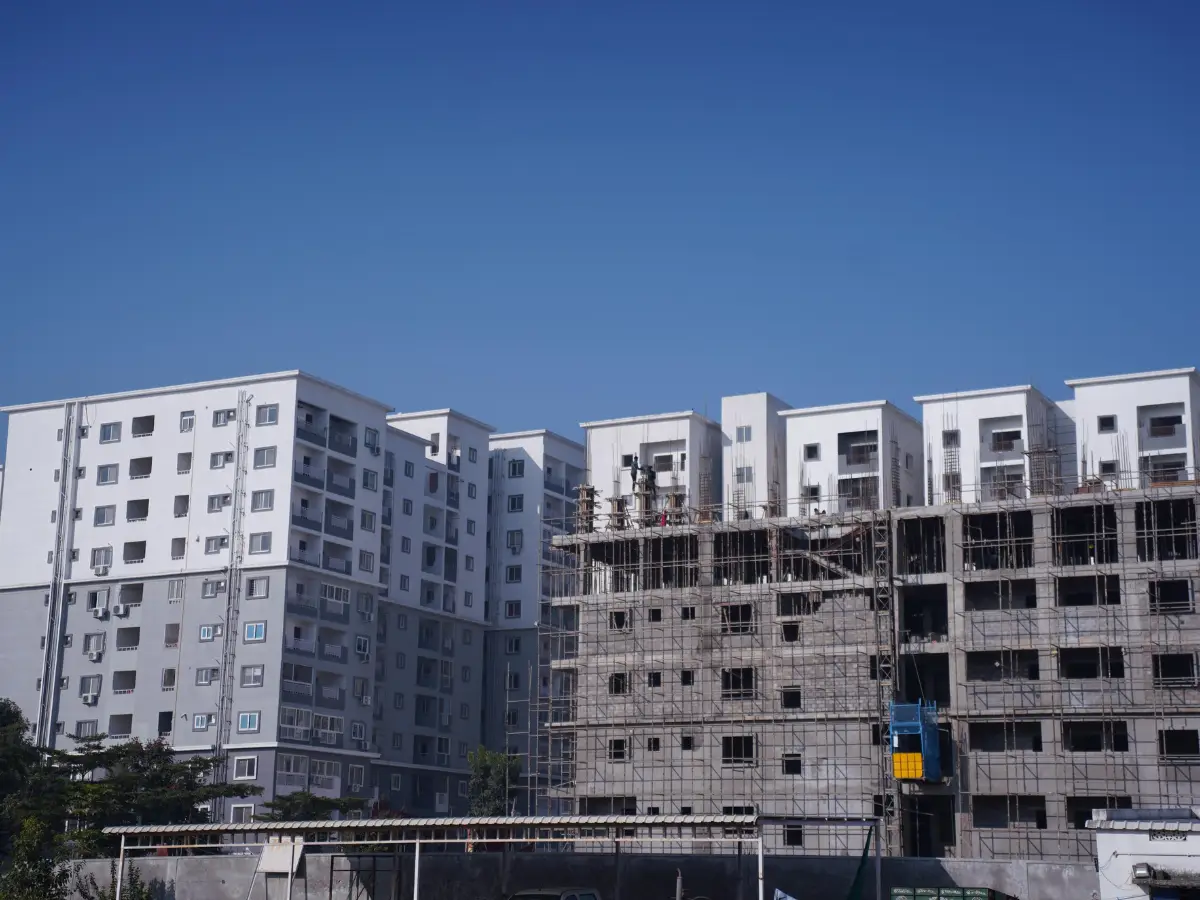 Assisted living for seniors in Kukatpally Hyderabad Telangana — caregiver attending elderly resident in facility courtyard